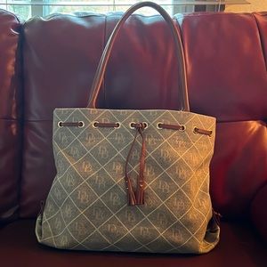 Dooney and Bourke Tan canvas and leather Monogram purse, gently Used